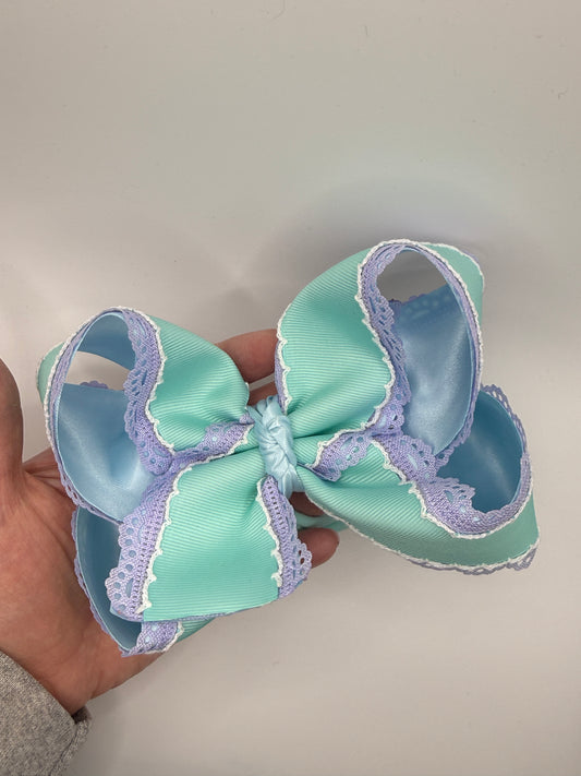 “Monsters” made to match outfit pictured. 5.5 inches on clip or thin nylon band. (Outfit not included).